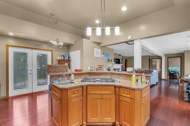 318 W Market St, Farmer City, IL 61842 - kitchen with open floor plan, a sink, dark wood-style floors, french doors, and a center island with sink