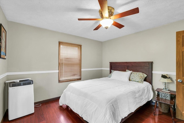 318 W Market St, Farmer City, IL 61842 - bedroom featuring wood finished floors, baseboards, a ceiling fan, and a textured ceiling
