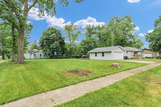 318 W Market St, Farmer City, IL 61842 - view of green lawn with an attached garage and driveway