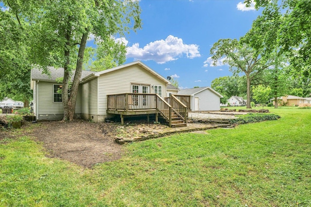 318 W Market St, Farmer City, IL 61842 - rear view of house featuring a deck, a lawn, and crawl space