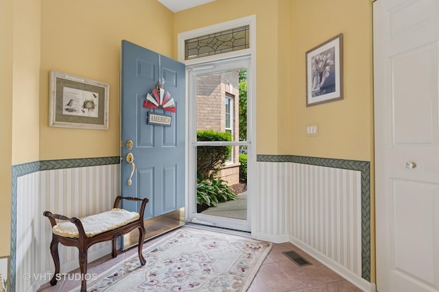 21513 W Douglas Ln, Plainfield, IL 60544 - foyer entrance featuring tile patterned floors and wainscoting