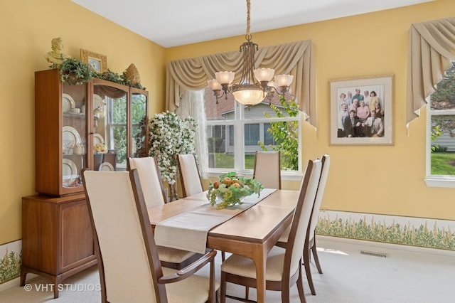 21513 W Douglas Ln, Plainfield, IL 60544 - dining area with a chandelier and light colored carpet