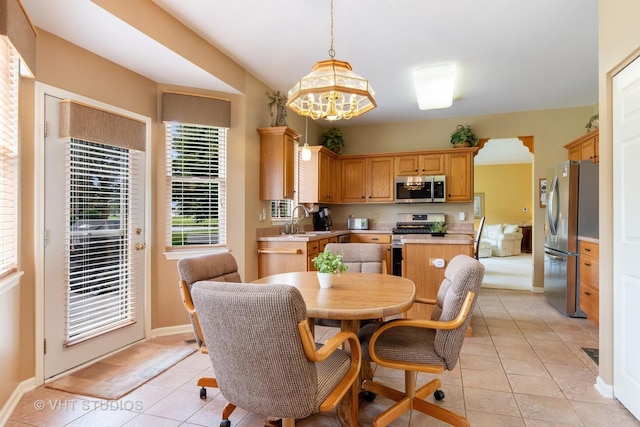 21513 W Douglas Ln, Plainfield, IL 60544 - dining space with light tile patterned flooring and a chandelier