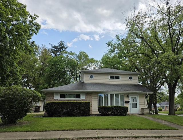 105 Marquette St, Park Forest, IL 60466 - view of front of property featuring a front lawn and a shingled roof