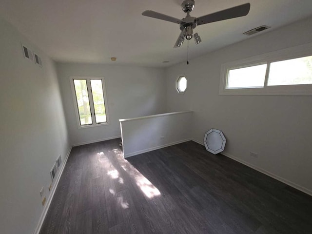 105 Marquette St, Park Forest, IL 60466 - spare room with healthy amount of natural light, a ceiling fan, wood finished floors, and baseboards