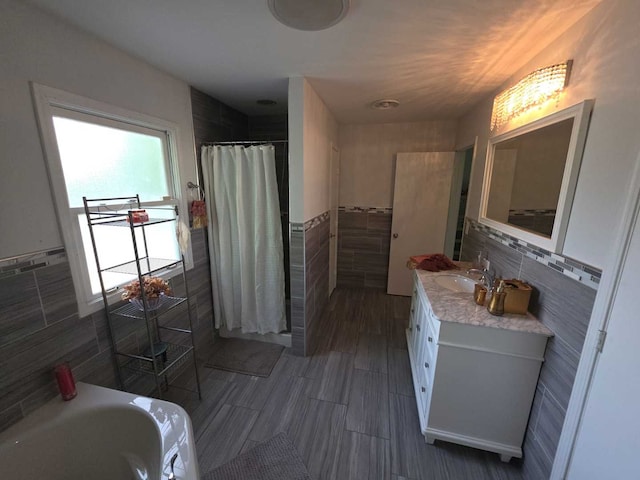 105 Marquette St, Park Forest, IL 60466 - full bathroom with tile walls, a tile shower, vanity, a bathtub, and a wainscoted wall
