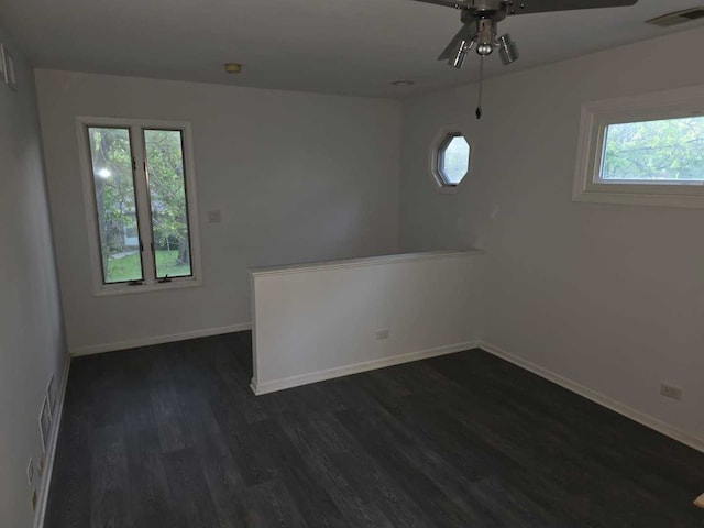 105 Marquette St, Park Forest, IL 60466 - unfurnished room featuring ceiling fan, dark wood-style floors, plenty of natural light, and baseboards