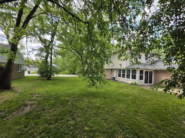 105 Marquette St, Park Forest, IL 60466 - view of grassy yard with central AC unit