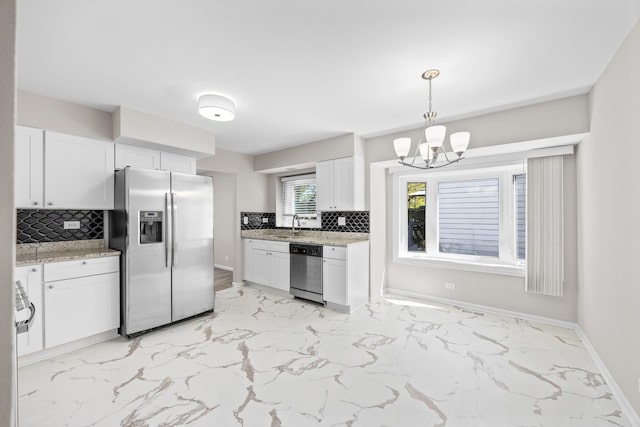 4435 Black Partridge Ln, Lisle, IL 60532 - kitchen with stainless steel appliances, a chandelier, decorative backsplash, white cabinets, and light marble finish flooring