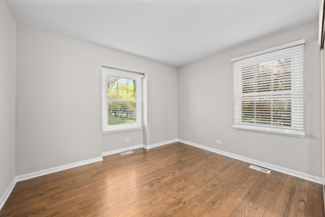4435 Black Partridge Ln, Lisle, IL 60532 - spare room with wood finished floors and baseboards