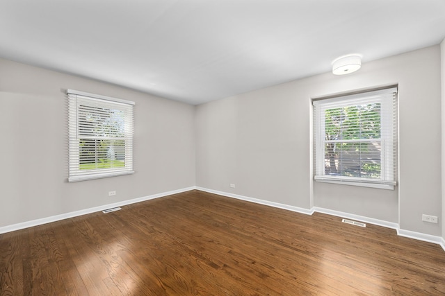 4435 Black Partridge Ln, Lisle, IL 60532 - empty room with dark wood-style flooring and baseboards