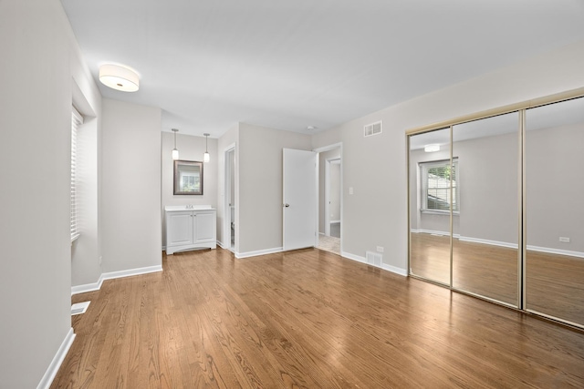 4435 Black Partridge Ln, Lisle, IL 60532 - unfurnished bedroom featuring wood finished floors, baseboards, and a closet