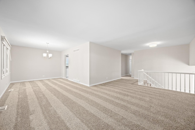 4435 Black Partridge Ln, Lisle, IL 60532 - unfurnished room featuring light carpet, baseboards, and a chandelier
