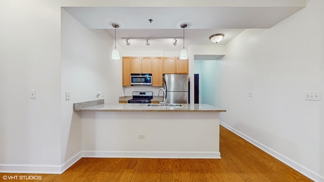 1400 S Michigan Ave Unit 1211, Chicago, IL 60605 - kitchen with appliances with stainless steel finishes, a sink, wood finished floors, and baseboards