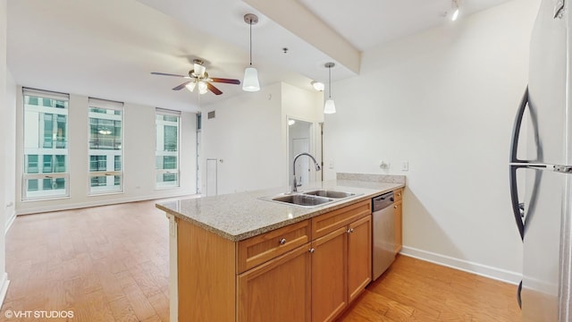 1400 S Michigan Ave Unit 1211, Chicago, IL 60605 - kitchen featuring freestanding refrigerator, a sink, stainless steel dishwasher, a peninsula, and light wood-type flooring