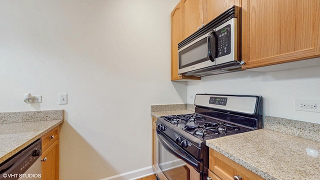 1400 S Michigan Ave Unit 1211, Chicago, IL 60605 - kitchen with appliances with stainless steel finishes, light countertops, and baseboards