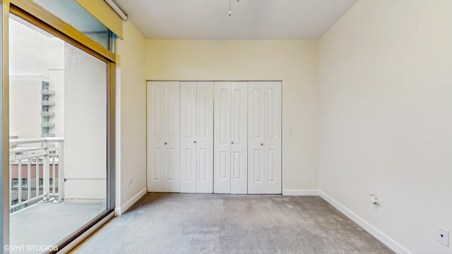 1400 S Michigan Ave Unit 1211, Chicago, IL 60605 - unfurnished bedroom with carpet flooring, baseboards, and a closet