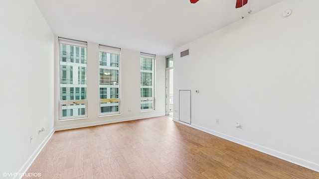 1400 S Michigan Ave Unit 1211, Chicago, IL 60605 - spare room with a ceiling fan, wood finished floors, baseboards, and a smoke detector
