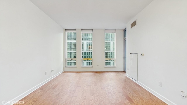 1400 S Michigan Ave Unit 1211, Chicago, IL 60605 - spare room with light wood-style flooring and baseboards