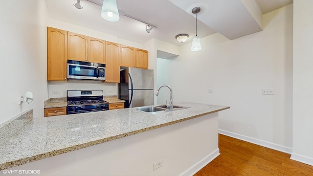 1400 S Michigan Ave Unit 1211, Chicago, IL 60605 - kitchen with stainless steel appliances, a sink, wood finished floors, baseboards, and light stone countertops
