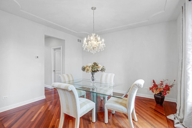 22665 Joshua Dr, Frankfort, IL 60423 - dining space featuring a chandelier, wood finished floors, and baseboards