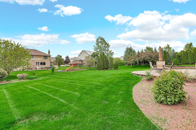 22665 Joshua Dr, Frankfort, IL 60423 - view of grassy yard with a playground and a patio area
