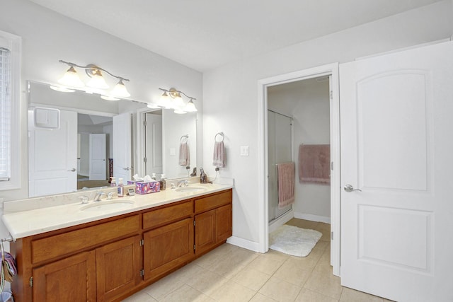 22665 Joshua Dr, Frankfort, IL 60423 - bathroom featuring double vanity, tile patterned flooring, a stall shower, and baseboards