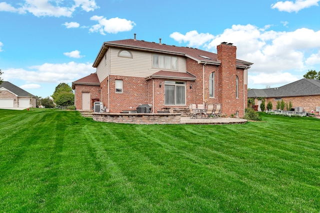 22665 Joshua Dr, Frankfort, IL 60423 - rear view of property featuring a patio, a yard, brick siding, and a chimney