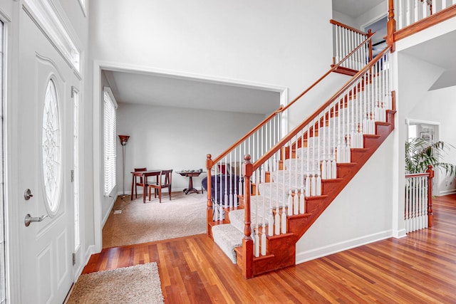 22665 Joshua Dr, Frankfort, IL 60423 - foyer with a towering ceiling, wood finished floors, stairs, and baseboards
