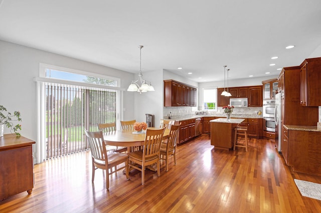 22665 Joshua Dr, Frankfort, IL 60423 - dining space featuring dark wood-style floors, a chandelier, and recessed lighting