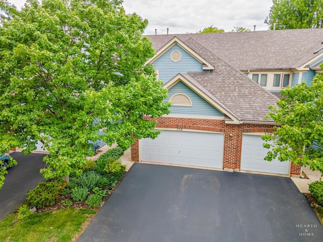 358 Bristol Ln, Fox River Grove, IL 60021 - view of front of property with a shingled roof, asphalt driveway, a garage, and brick siding
