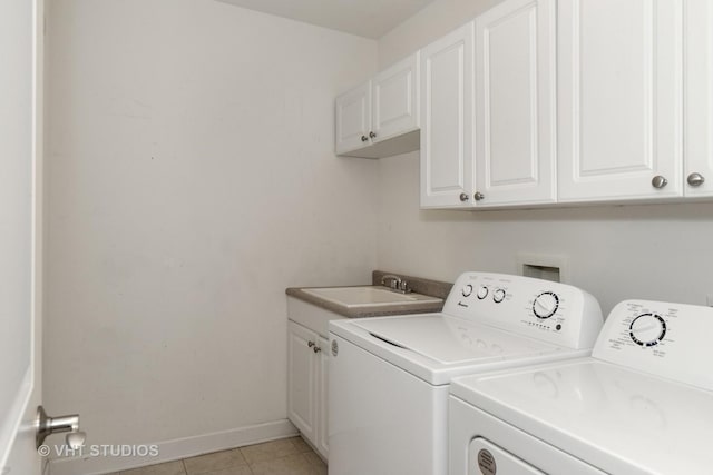 50 N Plum Grove Rd Unit 704E, Palatine, IL 60067 - laundry area with cabinet space, washing machine and dryer, light tile patterned floors, and baseboards
