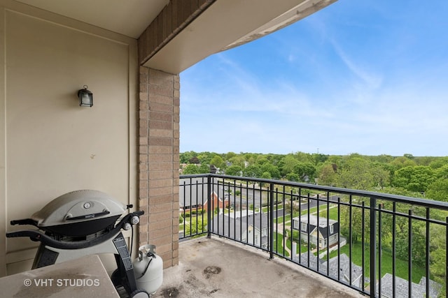 50 N Plum Grove Rd Unit 704E, Palatine, IL 60067 - balcony with grilling area and a view of trees