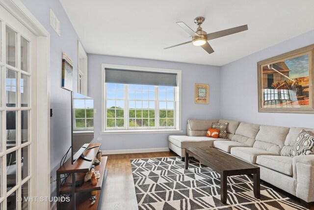 50 N Plum Grove Rd Unit 704E, Palatine, IL 60067 - living area featuring wood finished floors, a ceiling fan, and baseboards