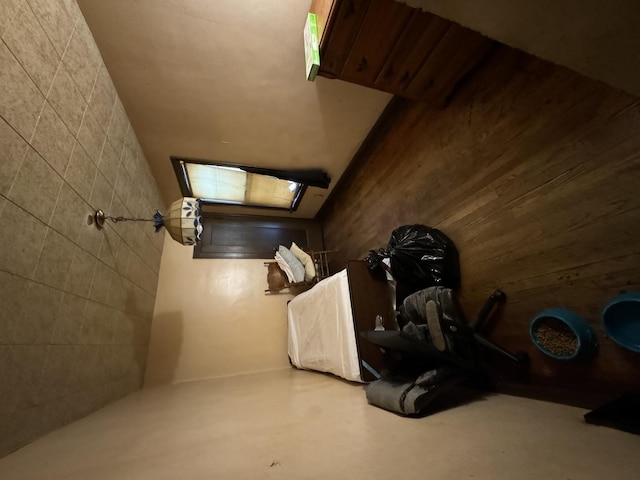 7145 S Seeley Ave, Chicago, IL 60636 - bedroom featuring concrete flooring and wood walls