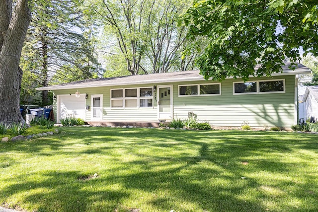 309 River Dr, Dekalb, IL 60115 - ranch-style home with a front lawn and a garage