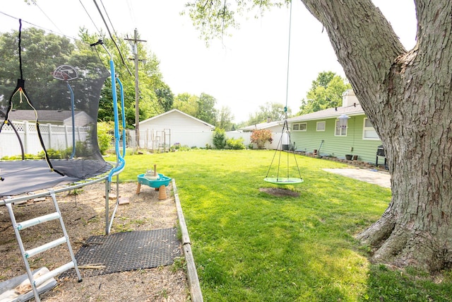 309 River Dr, Dekalb, IL 60115 - view of yard with a trampoline
