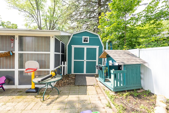 309 River Dr, Dekalb, IL 60115 - view of shed featuring a sunroom