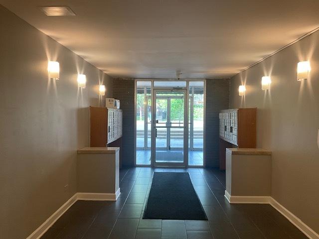 7854 S S Shore Dr Unit 306, Chicago, IL 60649 - community lobby with floor to ceiling windows
