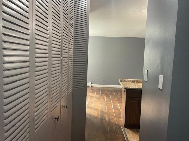 7854 S S Shore Dr Unit 306, Chicago, IL 60649 - hall featuring hardwood / wood-style flooring and baseboards