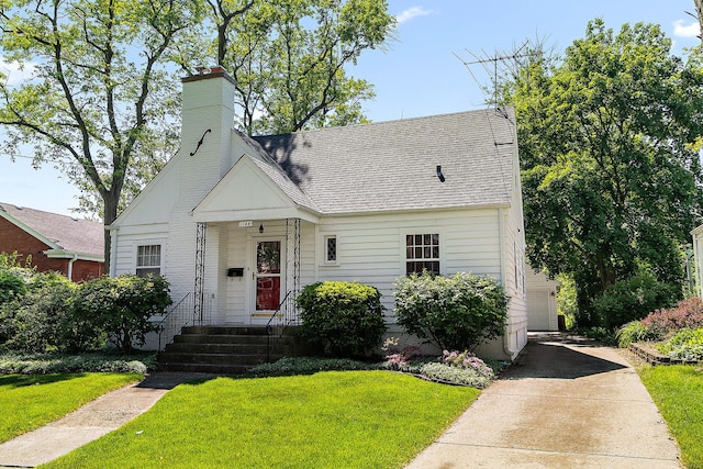 1144 Leavitt Ave, Flossmoor, IL 60422 - view of front of home featuring a chimney, a front lawn, and roof with shingles