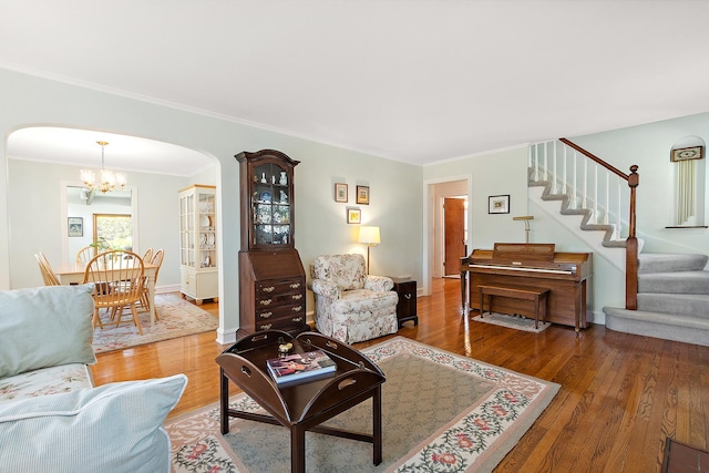 1144 Leavitt Ave, Flossmoor, IL 60422 - living room featuring arched walkways, a chandelier, light wood-style floors, stairway, and ornamental molding