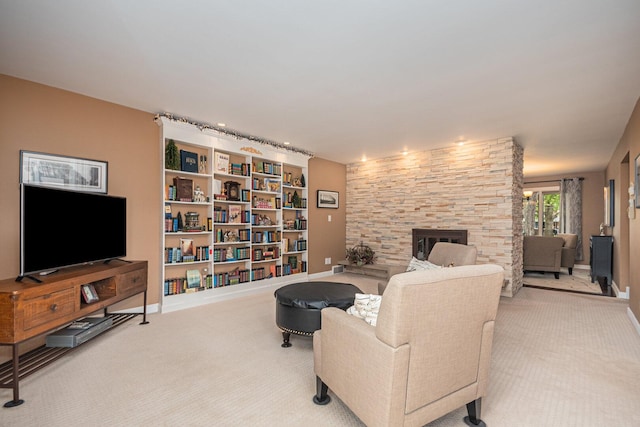 831 W Marywood Ave, Aurora, IL 60505 - living room featuring carpet floors, a fireplace, and baseboards