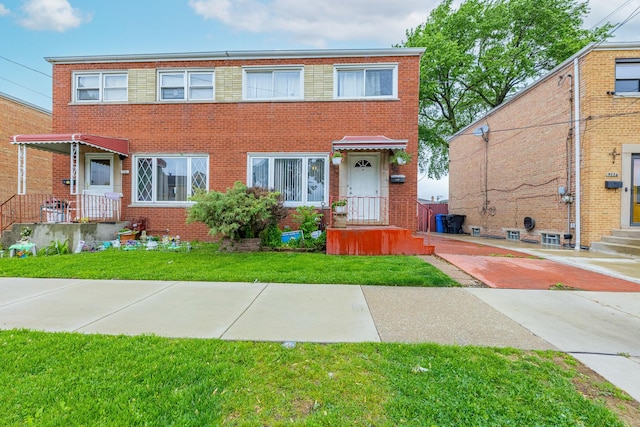 5228 W 54th St, Chicago, IL 60638 - view of property with brick siding and a front yard