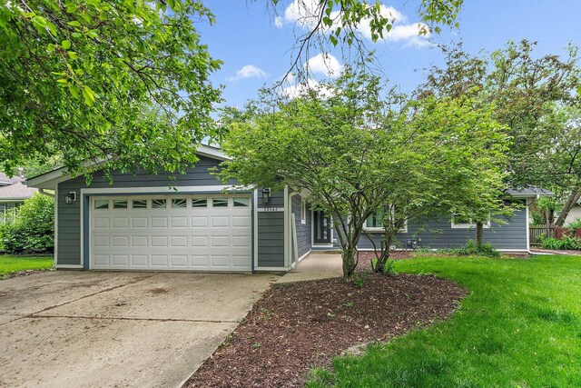 5S542 Tartan Ln, Naperville, IL 60563 - obstructed view of property with a front lawn and driveway