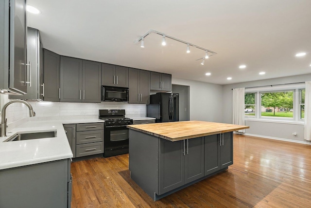 5S542 Tartan Ln, Naperville, IL 60563 - kitchen with black appliances, a sink, gray cabinetry, a center island, and wooden counters