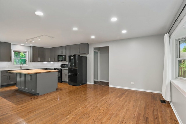 5S542 Tartan Ln, Naperville, IL 60563 - kitchen with black appliances, gray cabinetry, decorative backsplash, healthy amount of natural light, and recessed lighting