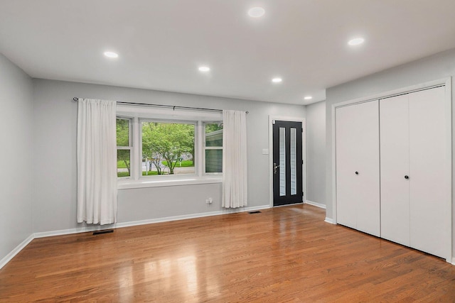 5S542 Tartan Ln, Naperville, IL 60563 - unfurnished bedroom with wood finished floors, baseboards, recessed lighting, and a closet