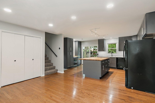 5S542 Tartan Ln, Naperville, IL 60563 - kitchen with black appliances, butcher block counters, gray cabinetry, a kitchen island, and light wood-style floors