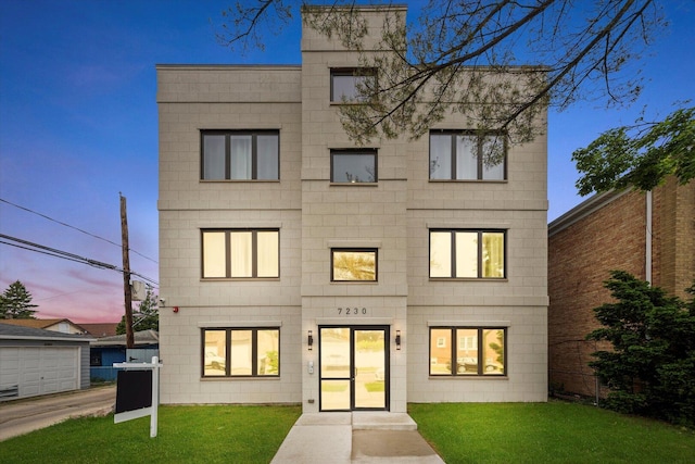 7230 W Belden Ave Unit 1, Elmwood Park, IL 60707 - rear view of property featuring a lawn